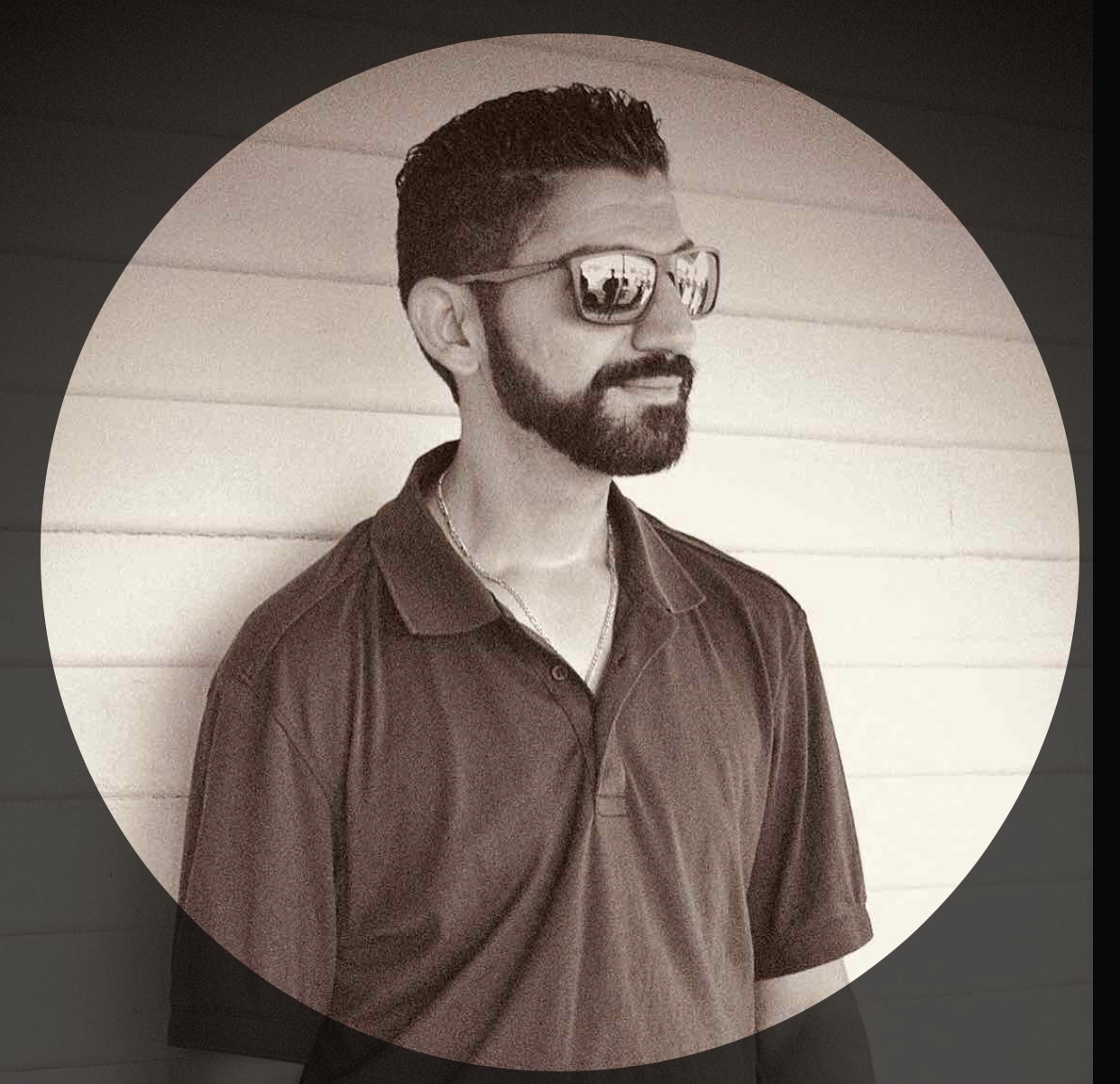 Owner and founder of Black Diamond Asphalt SoCal posing in professional polo and sunglasses.